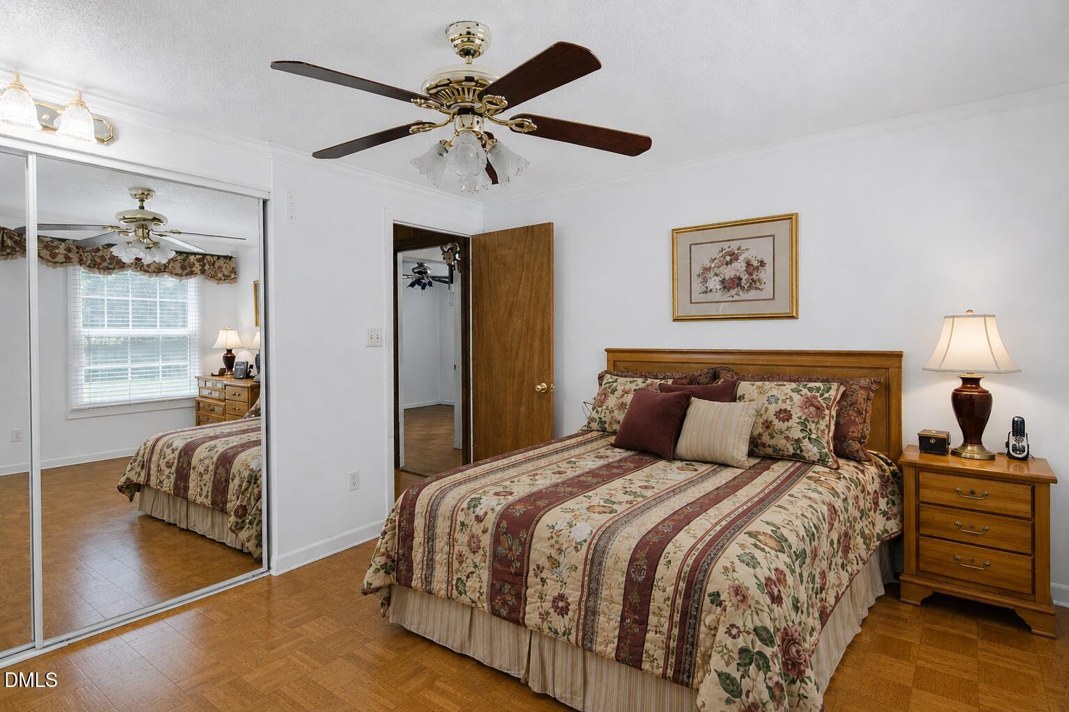 1302 Blacksmith Road Efland, NC 27243 - Photo 17 of 46 a bedroom with a bed and a chandelier