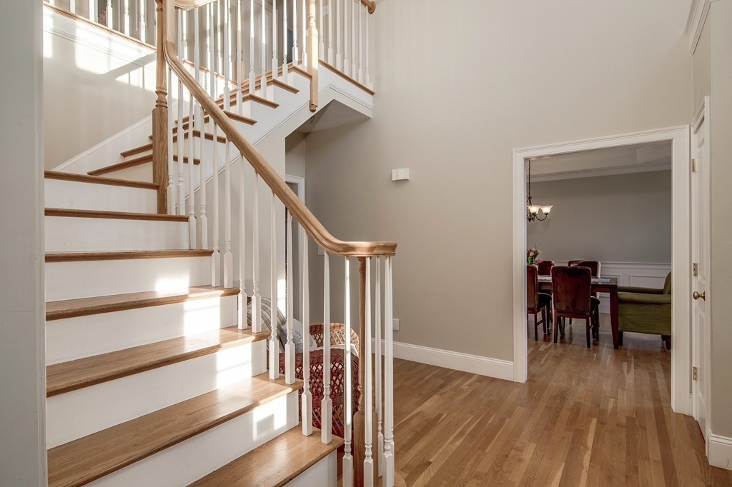 311 Still River Road Harvard, MA 01451 - Photo 14 of 27 a view of a hallway with wooden floor and staircase