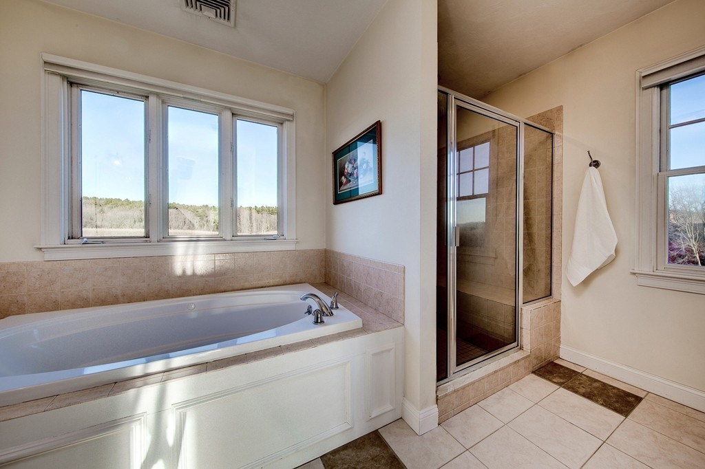 311 Still River Road Harvard, MA 01451 - Photo 18 of 27 a bathroom with a bathtub and a shower