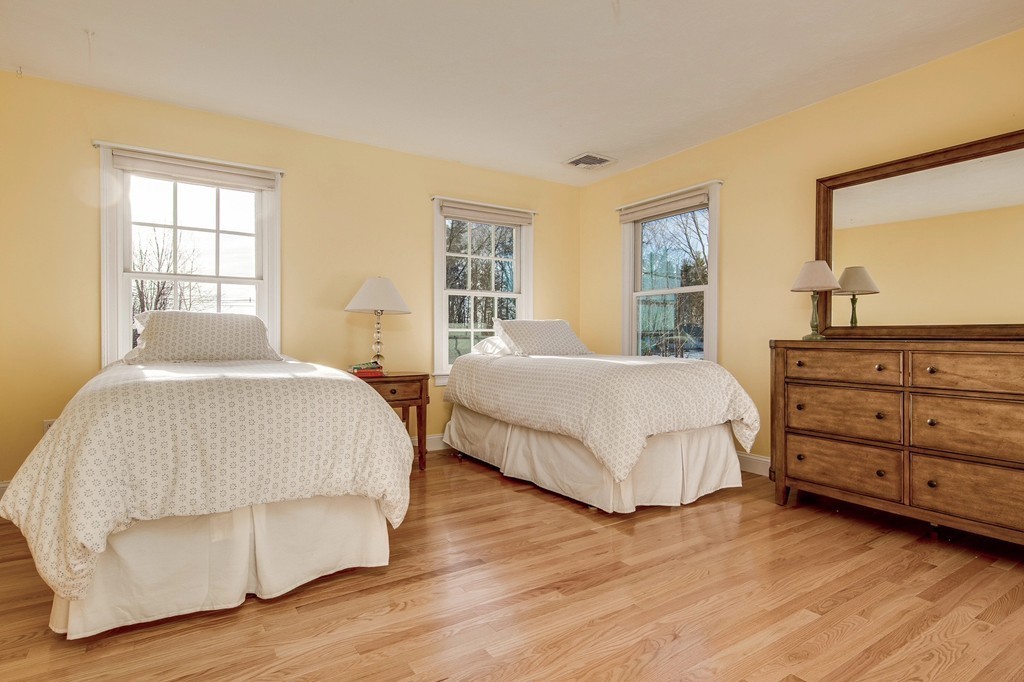 311 Still River Road Harvard, MA 01451 - Photo 20 of 27 a bedroom with a bed and a dresser
