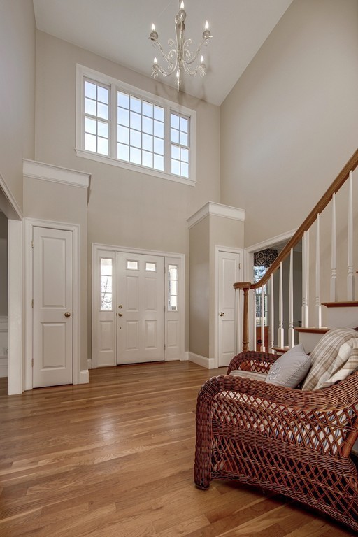 311 Still River Road Harvard, MA 01451 - Photo 2 of 27 a spacious bedroom with a bed a dresser and wooden floor
