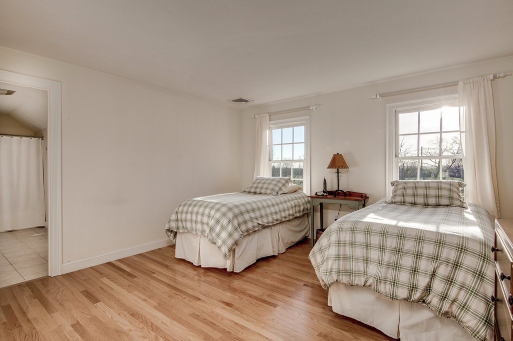 311 Still River Road Harvard, MA 01451 - Photo 24 of 27 a bedroom with two beds and windows