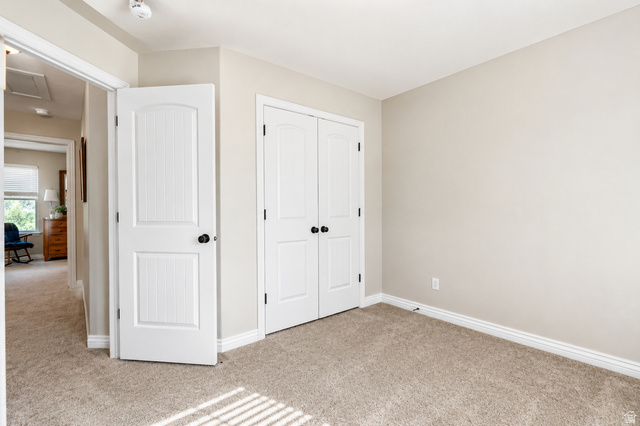 896 Cres Drive South Mapleton, UT 84664 - Photo 23 of 32 Neutral-toned room featuring light beige walls and complementing carpet flooring