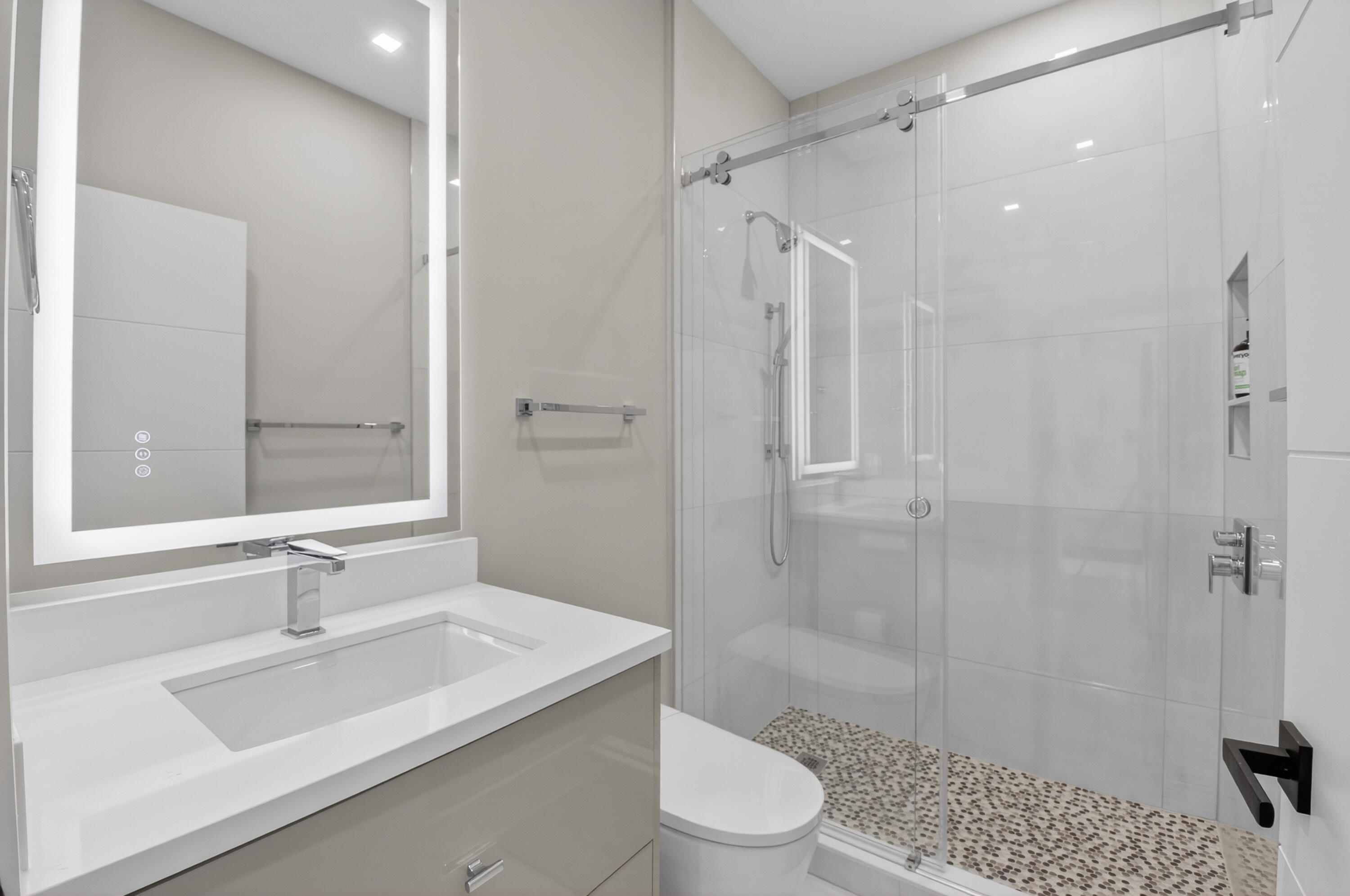 19221 Sabal Lake Drive, Unit 5124 Boca Raton, FL 33434 - Photo 34 of 98 a bathroom with a sink a toilet and shower