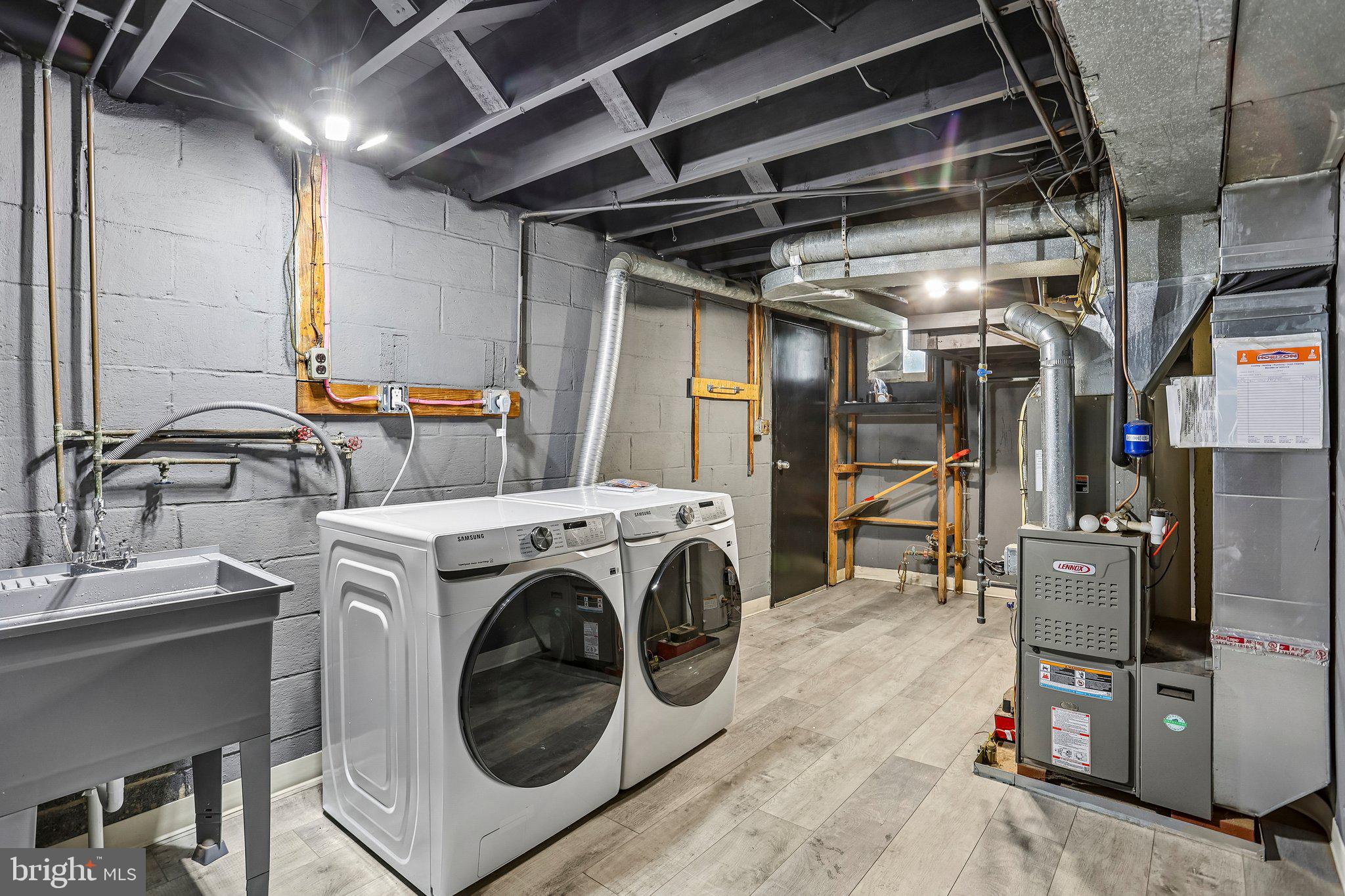 4008 Powell Road Brookhaven, PA 19015 - Photo 24 of 34 Modern laundry space with sleek appliances.