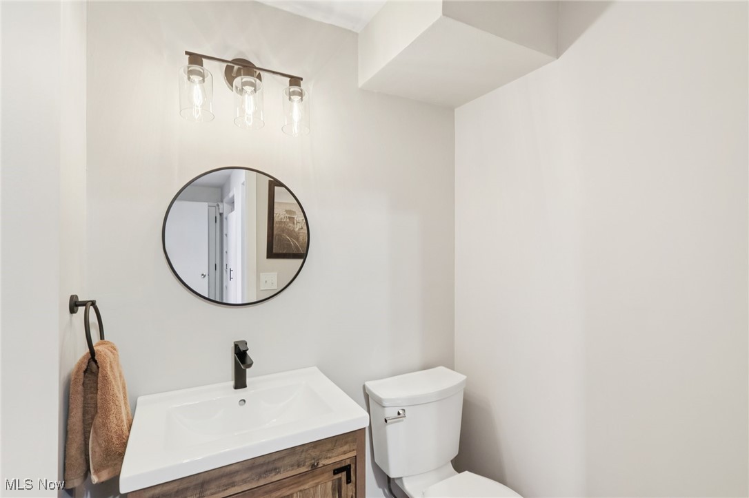 934 Canyon View Road Northfield, OH 44067 - Photo 18 of 24 Half bathroom with toilet and vanity