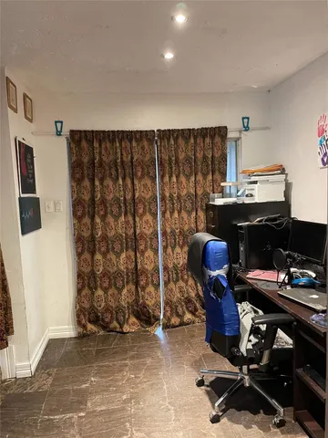 a view of workspace with wooden floor stairs and windows