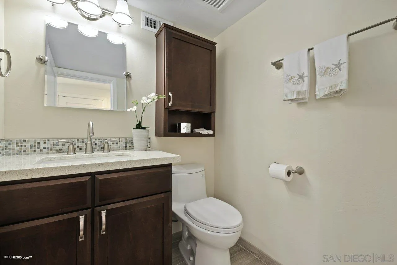 1540 Avenida De Las Lilas Encinitas, CA 92024 - Photo 16 of 39 a bathroom with a sink vanity granite and toilet