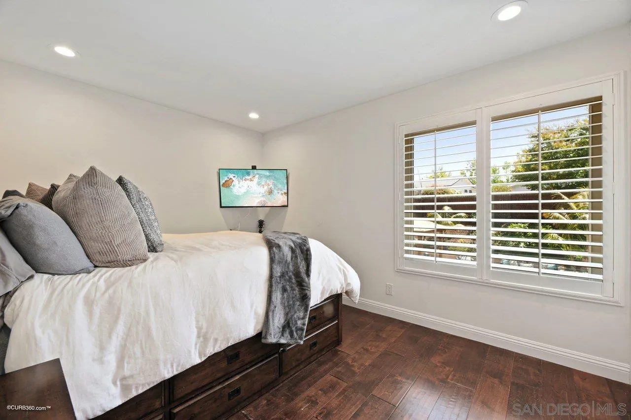 1540 Avenida De Las Lilas Encinitas, CA 92024 - Photo 20 of 39 a bed sitting in a bedroom next to a window