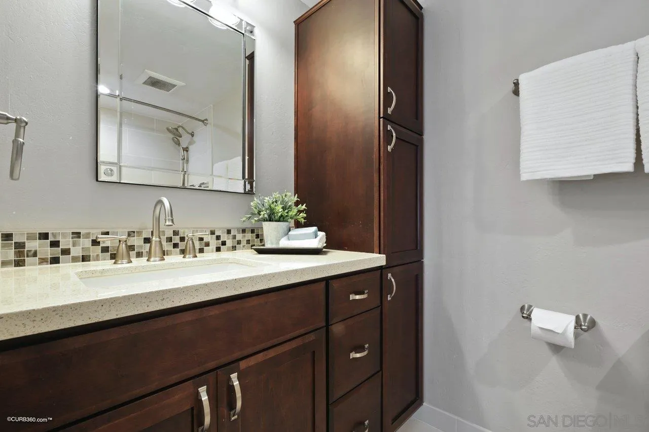 1540 Avenida De Las Lilas Encinitas, CA 92024 - Photo 21 of 39 a bathroom with a sink and a mirror