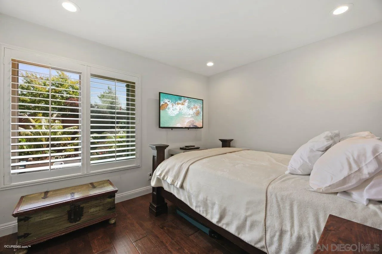 1540 Avenida De Las Lilas Encinitas, CA 92024 - Photo 22 of 39 a bedroom with a bed and a window