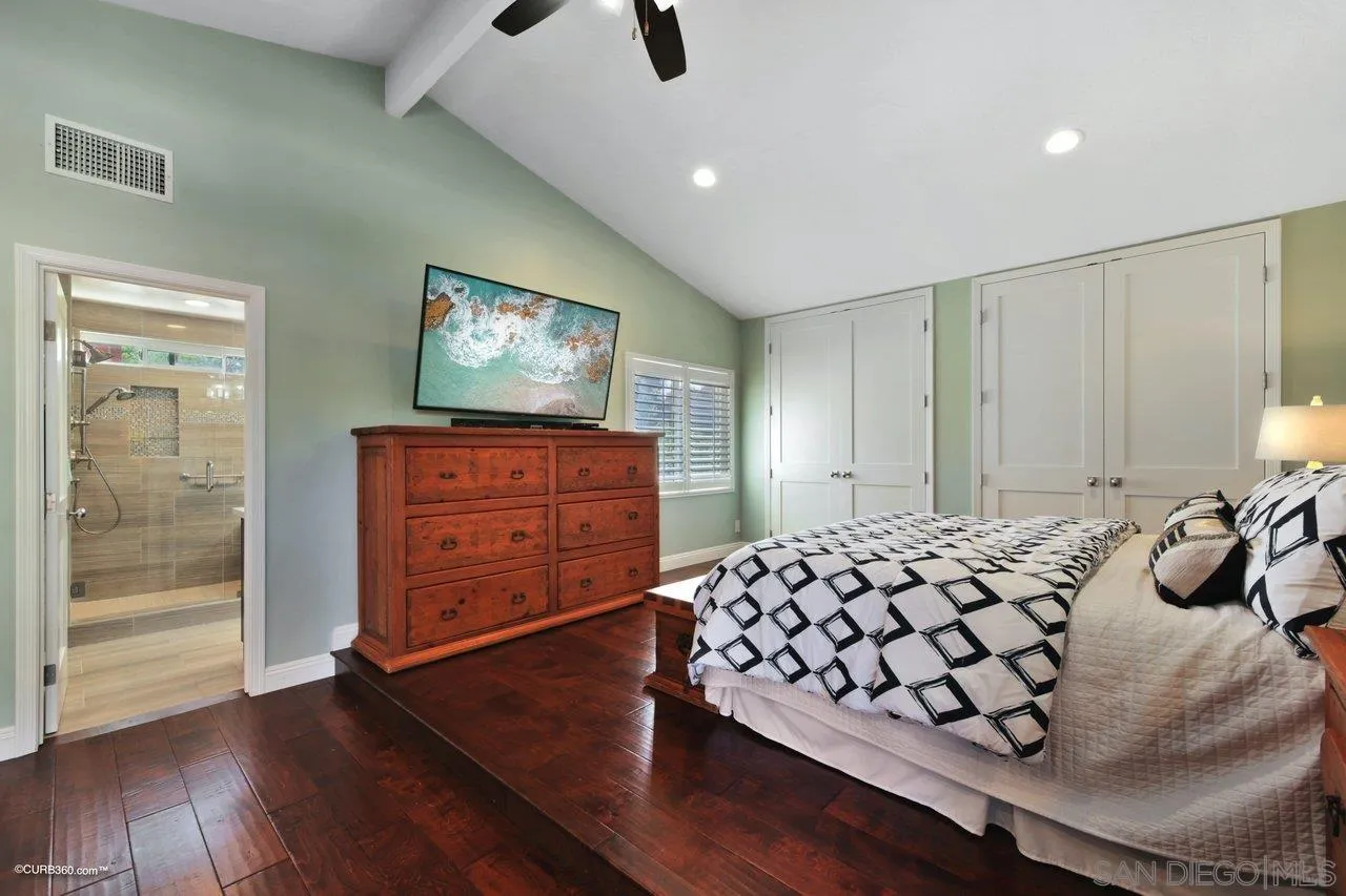 1540 Avenida De Las Lilas Encinitas, CA 92024 - Photo 27 of 39 a bedroom with a bed and wooden floor