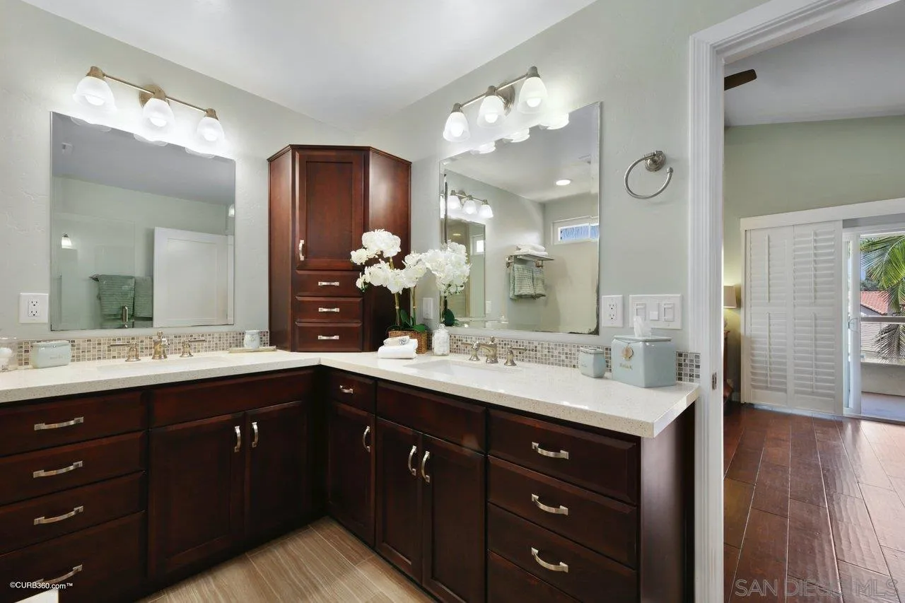 1540 Avenida De Las Lilas Encinitas, CA 92024 - Photo 28 of 39 a bathroom with a sink vanity granite and a mirror