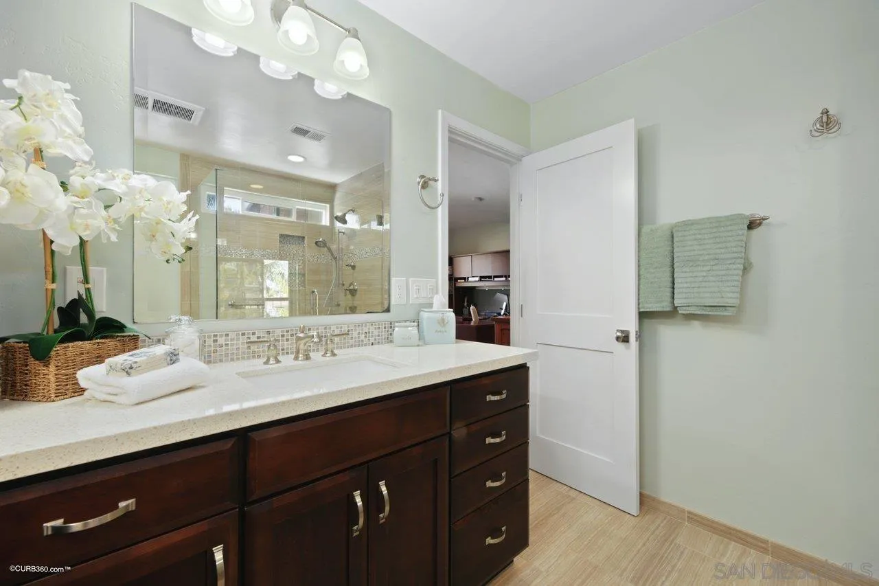 1540 Avenida De Las Lilas Encinitas, CA 92024 - Photo 29 of 39 a bathroom with a sink double vanity and a mirror