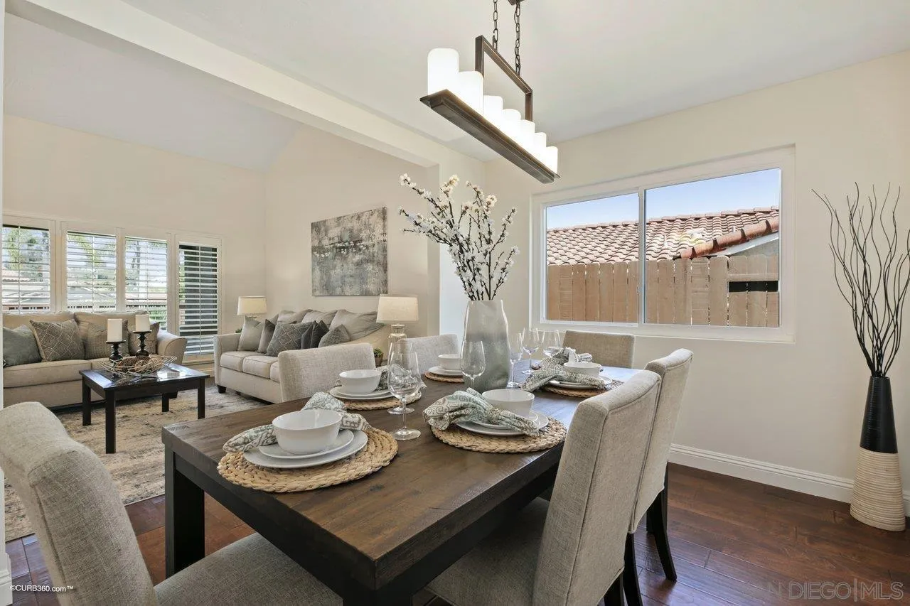 1540 Avenida De Las Lilas Encinitas, CA 92024 - Photo 10 of 39 a dining room with furniture a chandelier and wooden floor