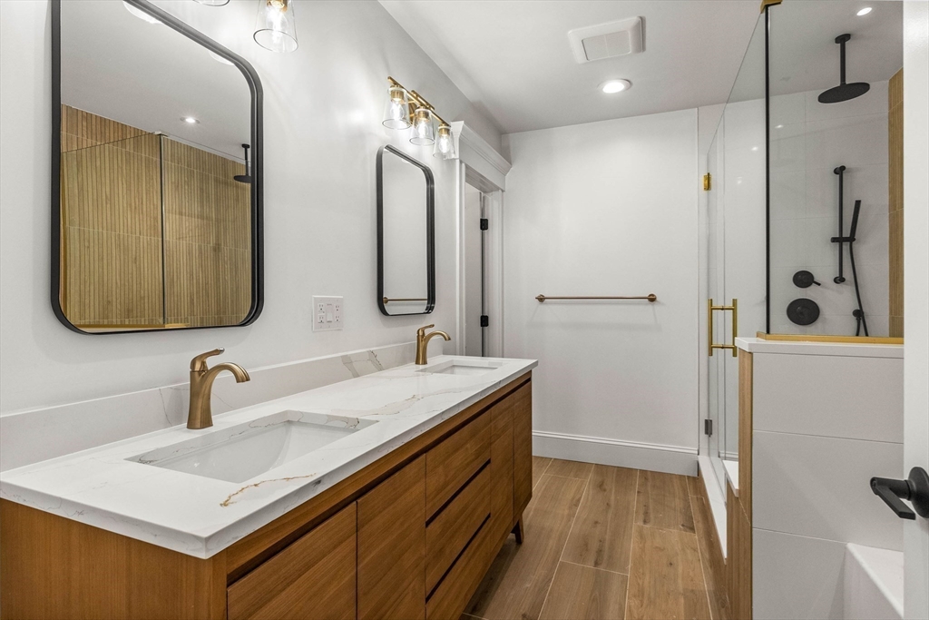 116 East Main Street, Unit 8 Gloucester, MA 01930 - Photo 16 of 31 a bathroom with a sink and a mirror