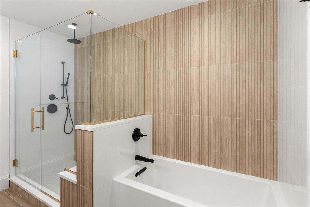 116 East Main Street, Unit 8 Gloucester, MA 01930 - Photo 18 of 31 a bathroom with a tub and shower