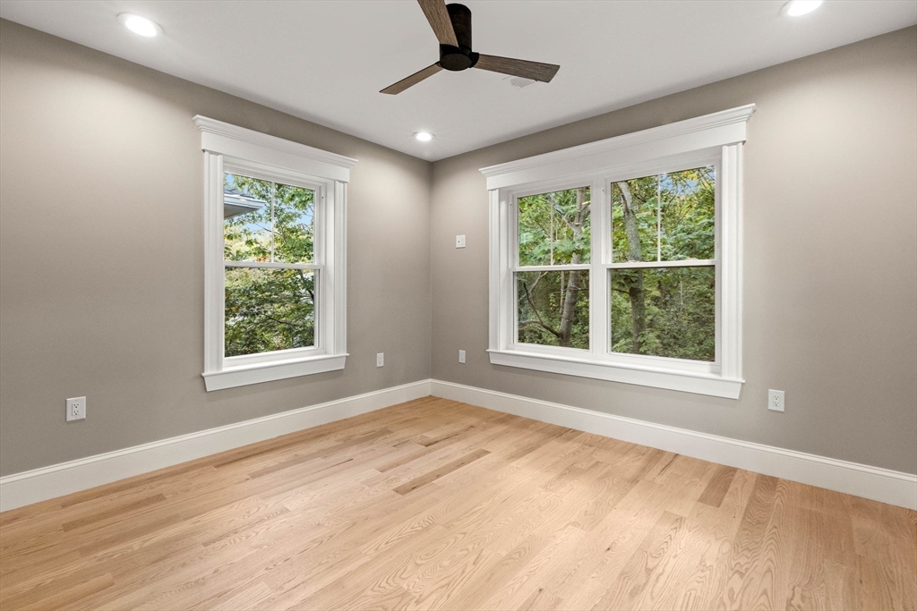116 East Main Street, Unit 8 Gloucester, MA 01930 - Photo 20 of 31 a view of an empty room with wooden floor and a window