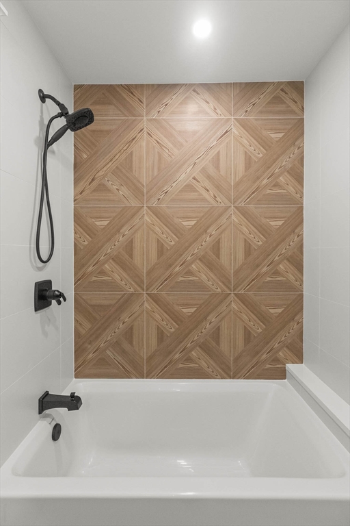 116 East Main Street, Unit 8 Gloucester, MA 01930 - Photo 23 of 31 a bathroom with a bathtub