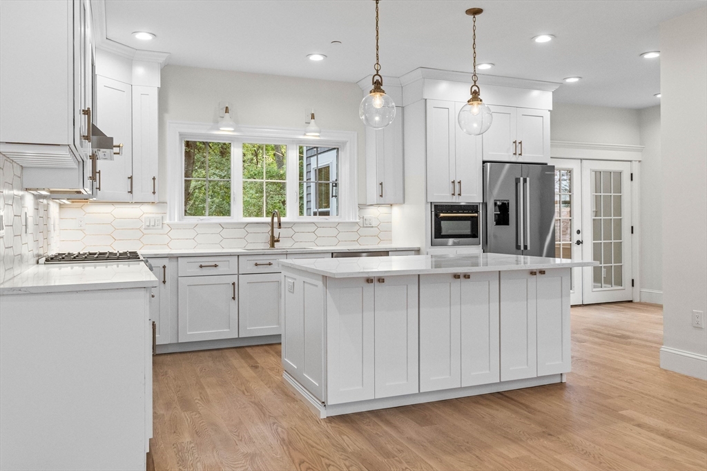 116 East Main Street, Unit 8 Gloucester, MA 01930 - Photo 4 of 31 a kitchen with a sink stove and refrigerator