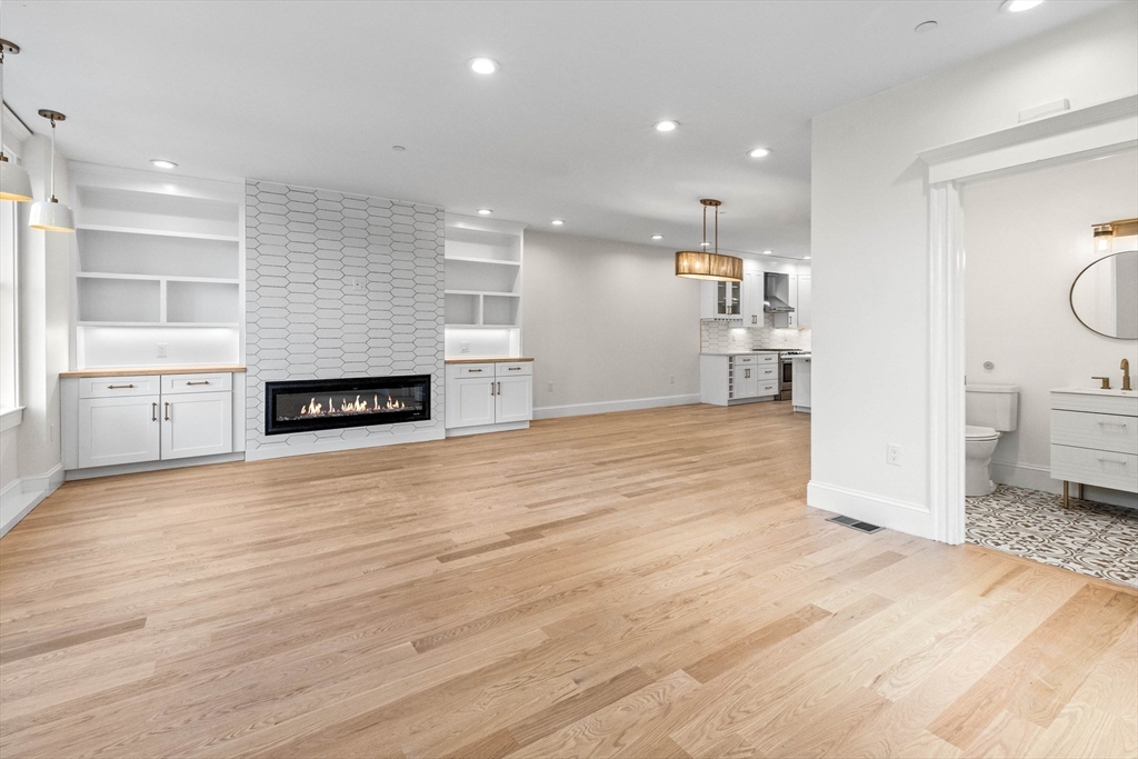 116 East Main Street, Unit 8 Gloucester, MA 01930 - Photo 7 of 31 a view of a kitchen with a sink and a stove