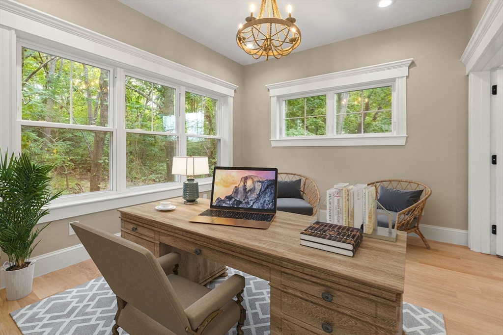 116 East Main Street, Unit 8 Gloucester, MA 01930 - Photo 9 of 31 a view of a dining room with furniture a chandelier and wooden floor