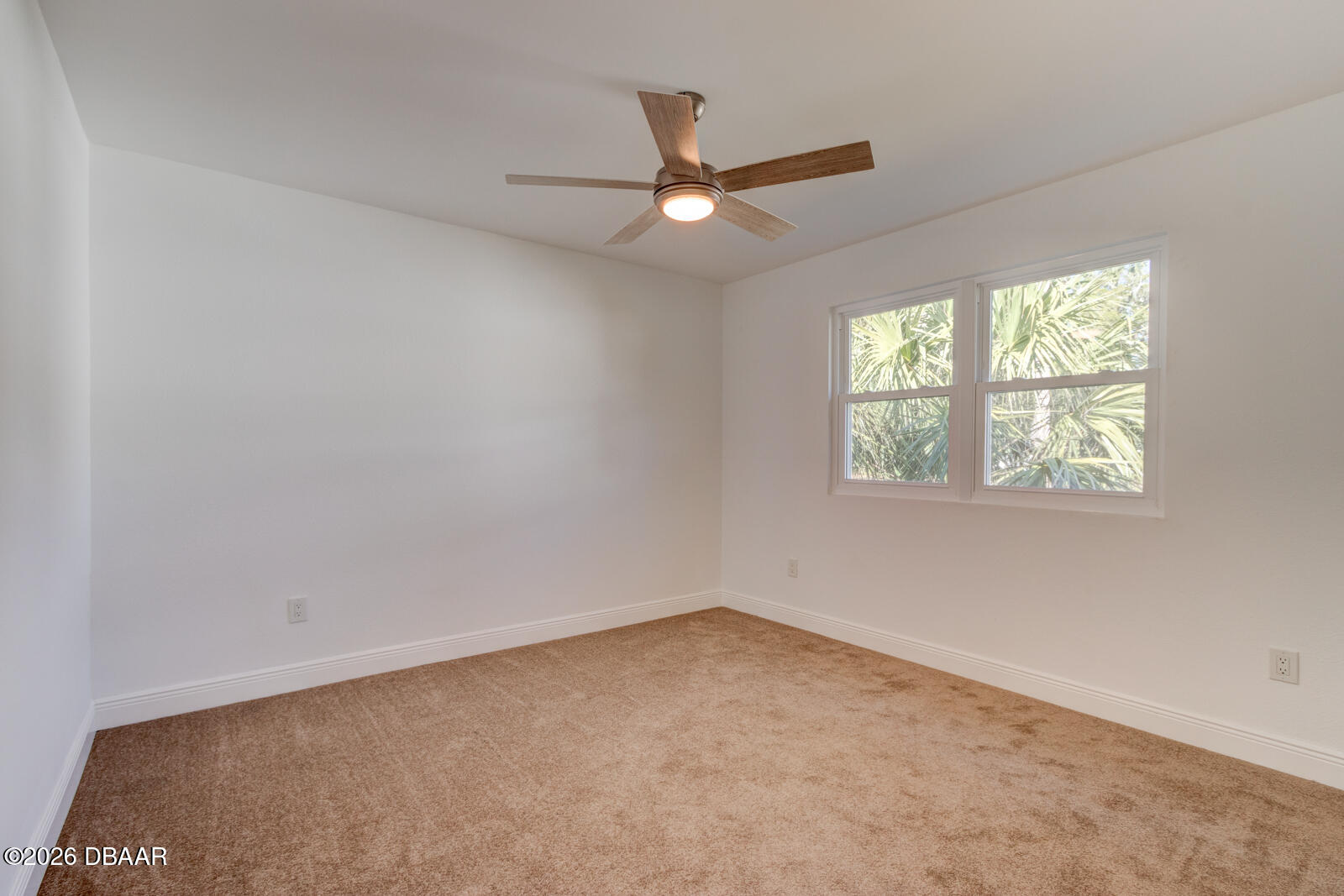 4 Main Street Port Orange, FL 32127 - Photo 12 of 17 an empty room with a window