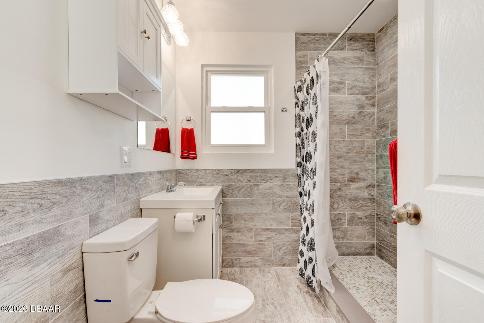 4 Main Street Port Orange, FL 32127 - Photo 14 of 17 a bathroom with a toilet and a shower