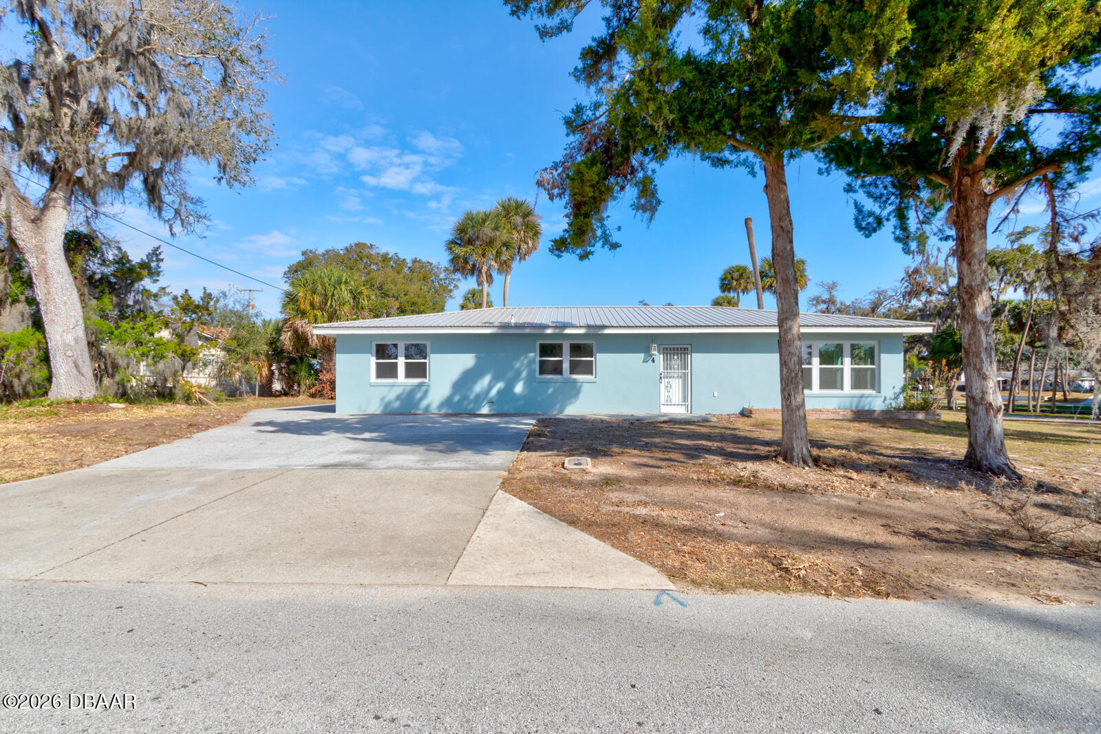 4 Main Street Port Orange, FL 32127 - Photo 3 of 17 front view of a house with a patio