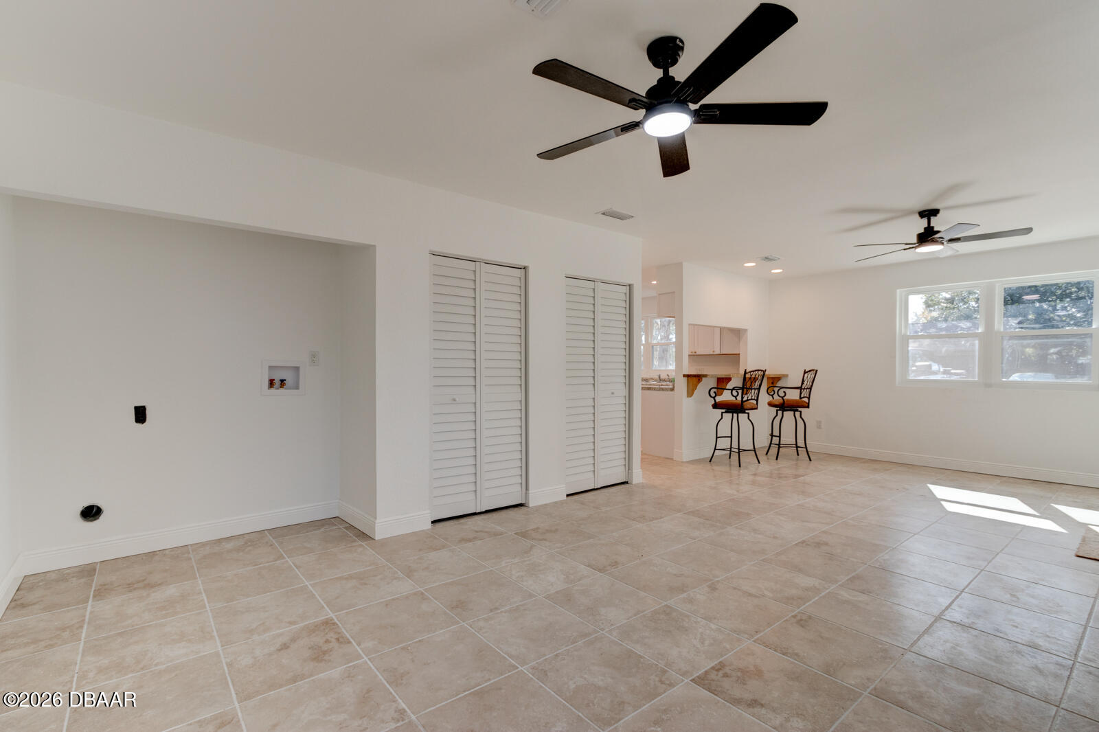 4 Main Street Port Orange, FL 32127 - Photo 8 of 17 a view of a livingroom with furniture and a ceiling fan