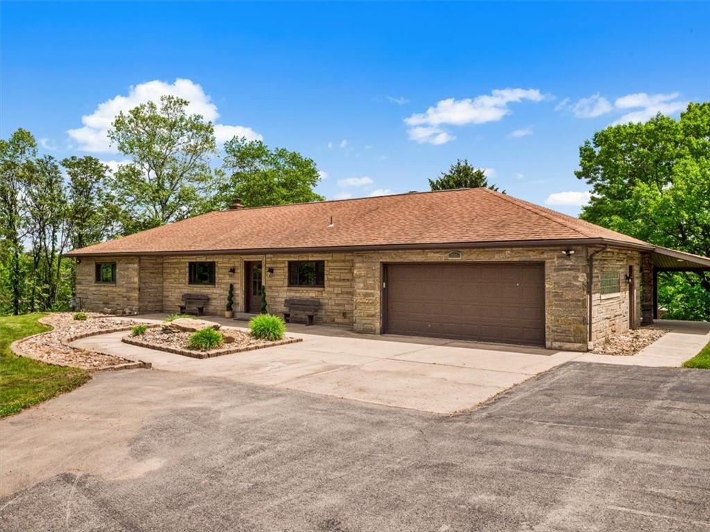 a front view of a house with yard and seating area