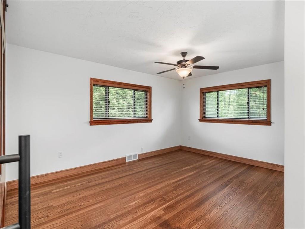 330 Center Grange Road Monaca, PA 15061 - Photo 13 of 42 a view of an empty room with wooden floor and a window