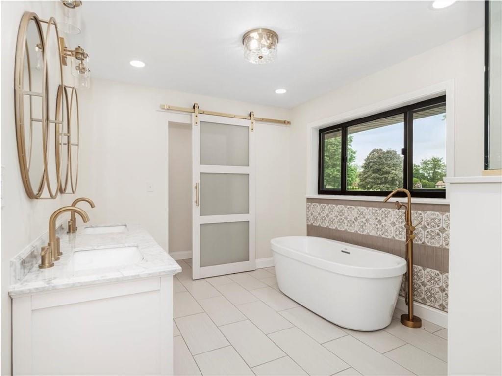 330 Center Grange Road Monaca, PA 15061 - Photo 16 of 42 a bathroom with a sink toilet and shower
