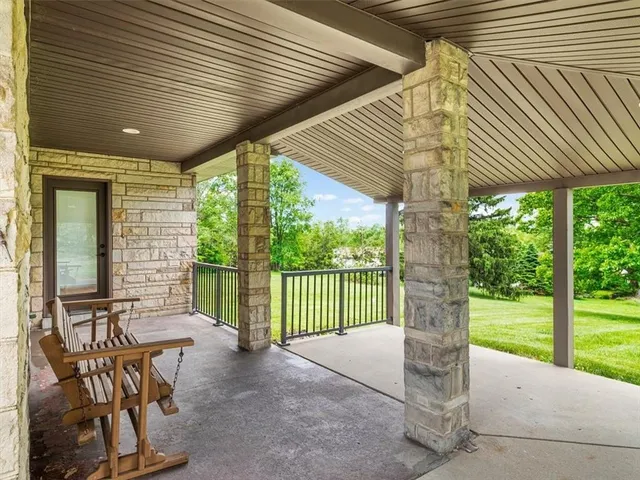 a view of a patio with a table chairs and backyard