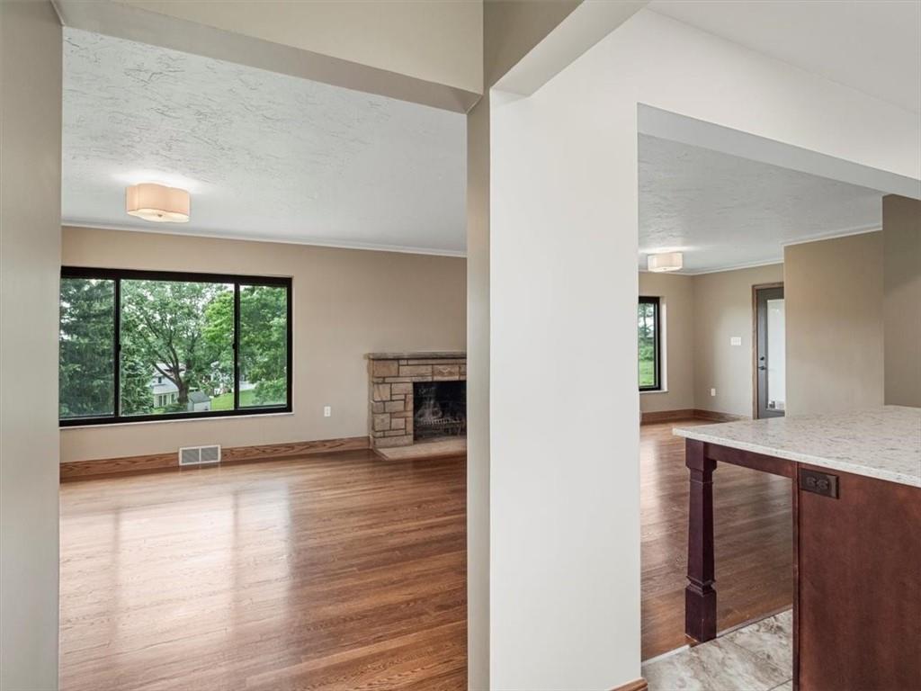330 Center Grange Road Monaca, PA 15061 - Photo 6 of 42 a view of an empty room with a window and wooden floor