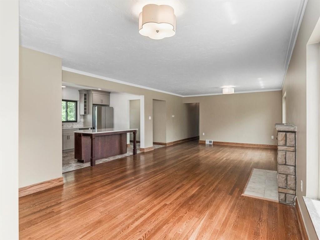 330 Center Grange Road Monaca, PA 15061 - Photo 10 of 42 a view of a room with wooden floor and staircase