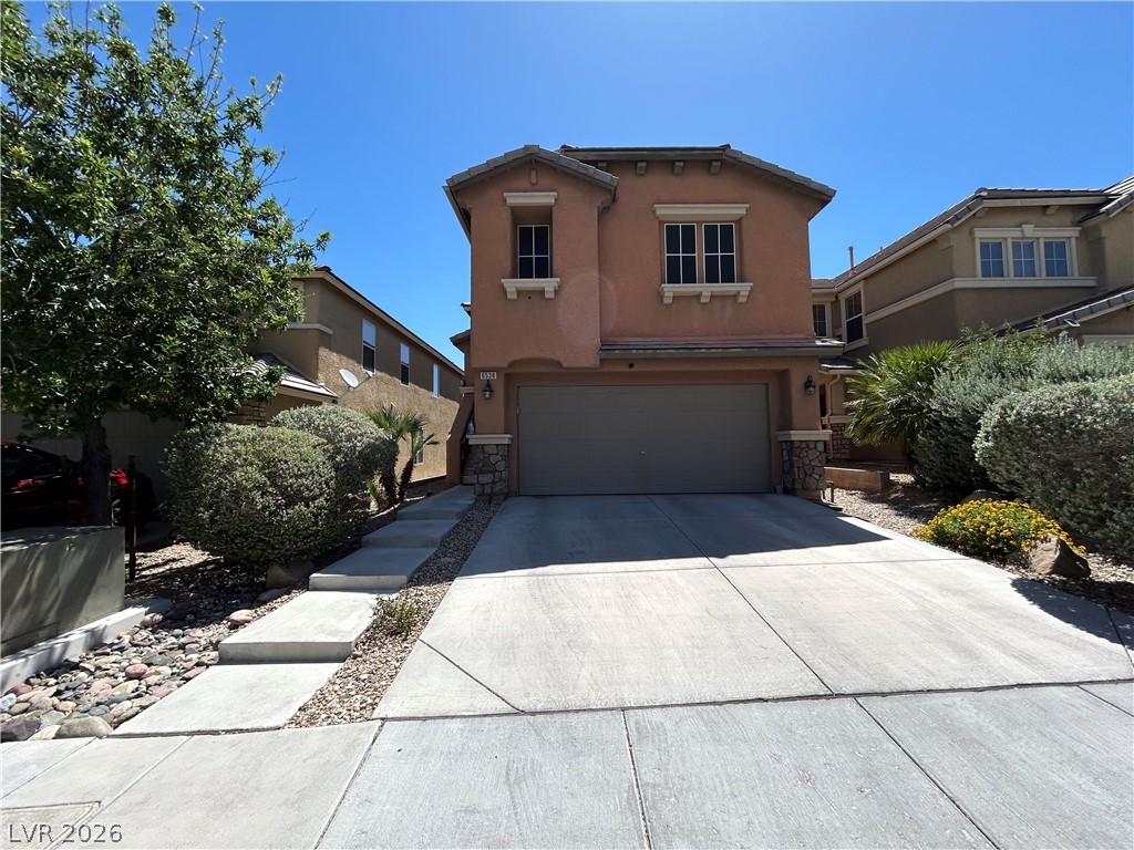 6538 Elm Spring Las Vegas, NV 89148 - Photo 1 of 29 Well-maintained landscaping frames this attractive stucco residence, featuring an integrated garage and concrete driveway.