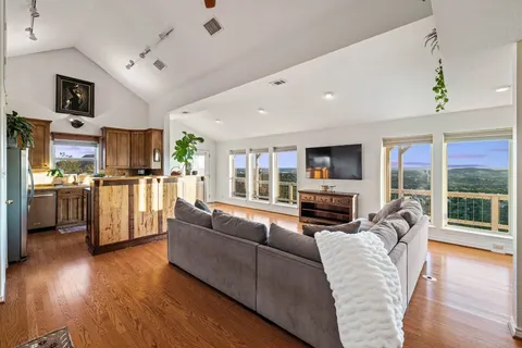 a kitchen with stainless steel appliances granite countertop a sink and cabinets