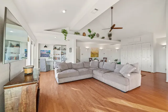a kitchen with a stove a sink and cabinets