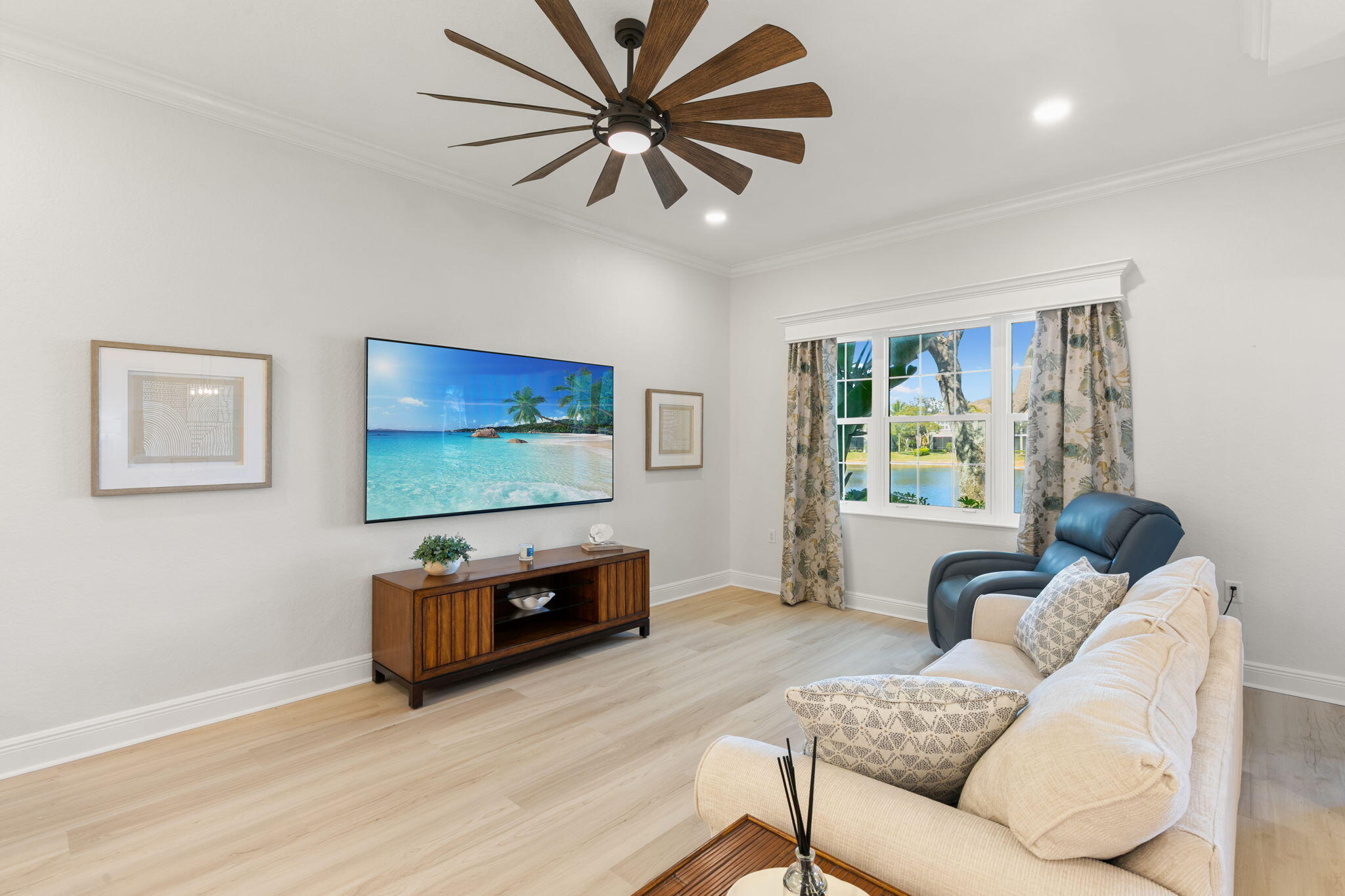 9213 Museo Circle, Unit 103 Naples, FL 34114 - Photo 12 of 47 a living room with furniture and a flat screen tv