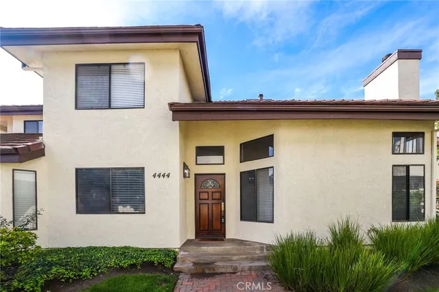 a front view of a house with yard