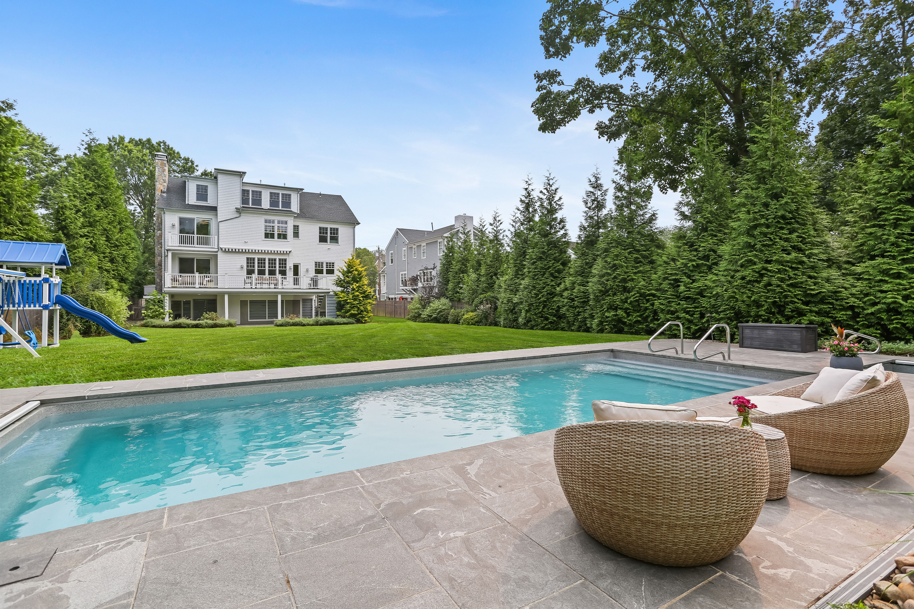a view of a swimming pool with a yard