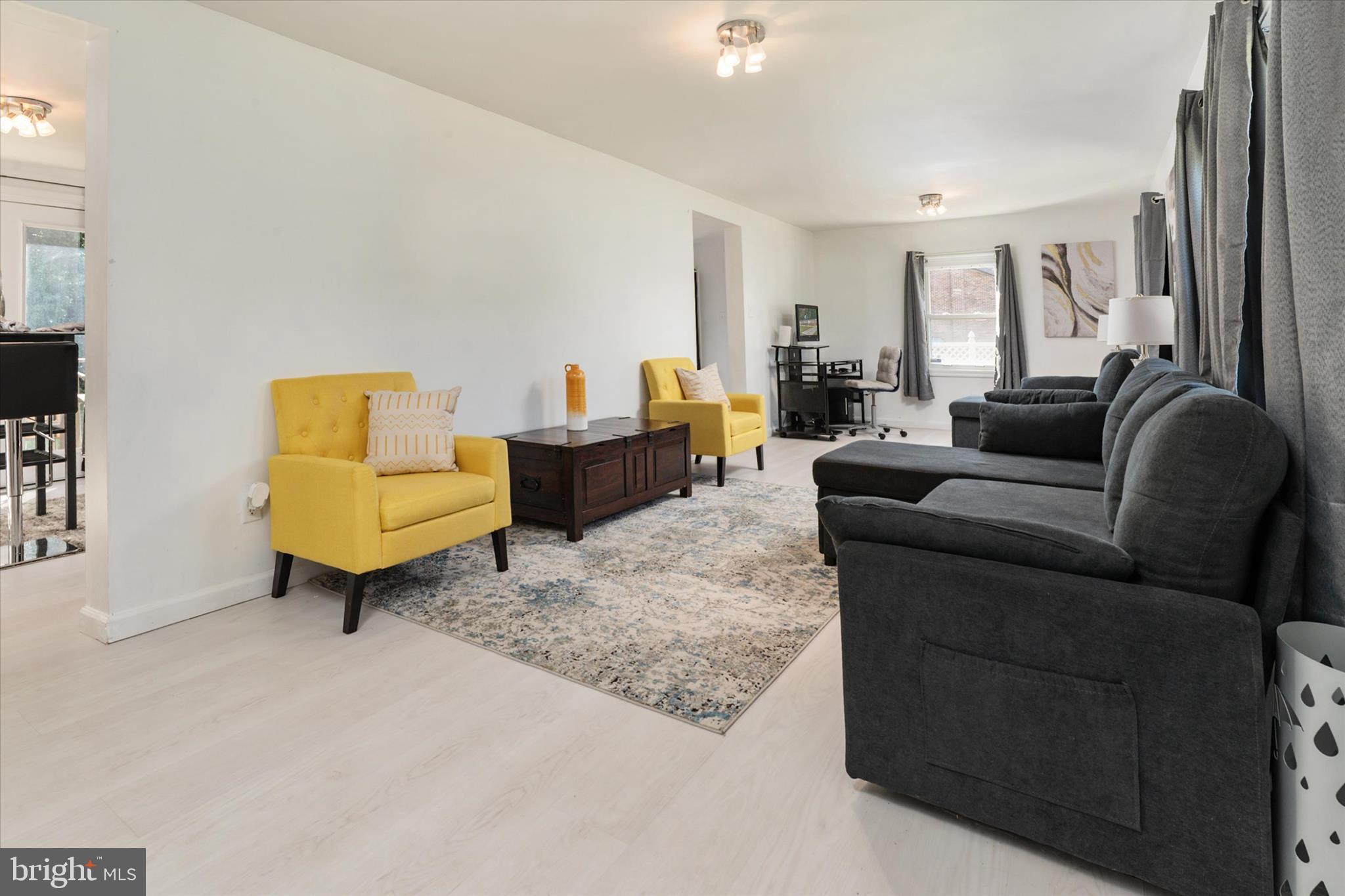 108 Wilson Road Grasonville, MD 21658 - Photo 5 of 38 a living room with furniture and a couch