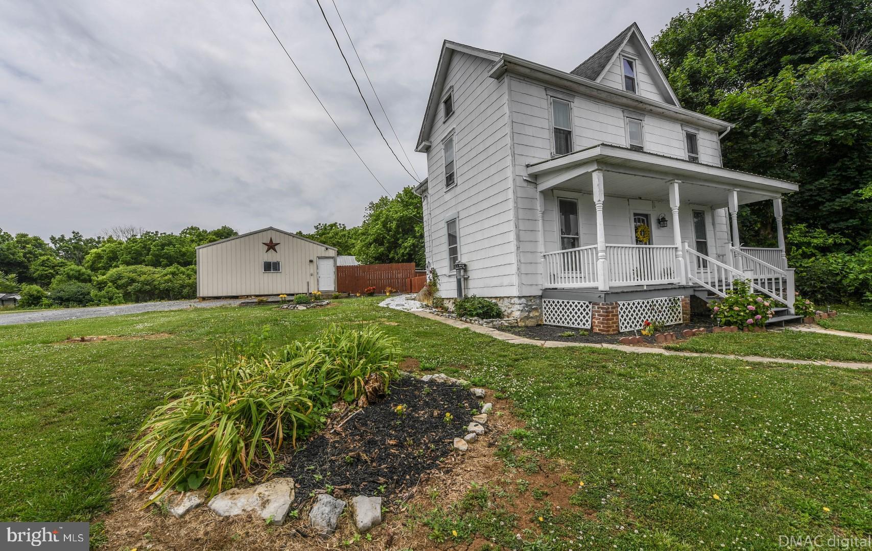 12512 Rockdale Road Clear Spring, MD 21722 - Photo 2 of 31 a front view of house with yard and green space