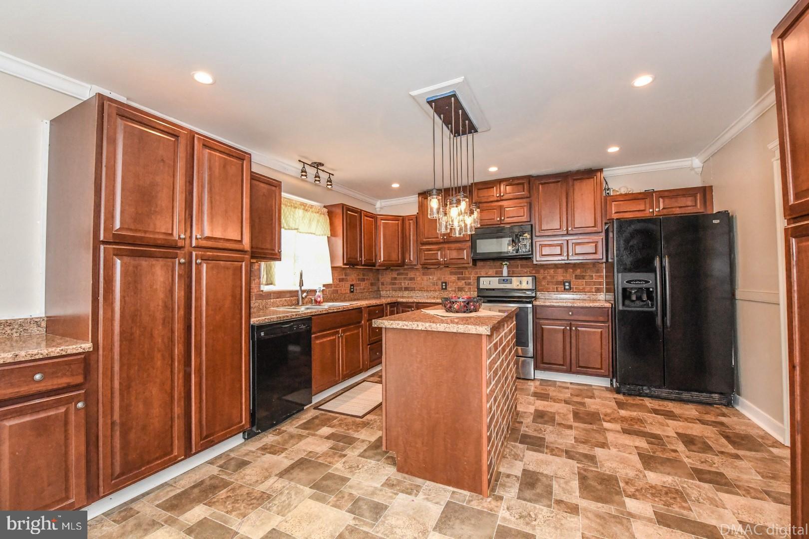 12512 Rockdale Road Clear Spring, MD 21722 - Photo 14 of 31 a kitchen with stainless steel appliances granite countertop a refrigerator and a stove top oven