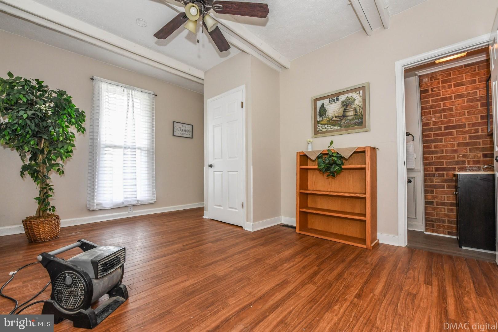 12512 Rockdale Road Clear Spring, MD 21722 - Photo 19 of 31 a view of a livingroom with furniture and wooden floor