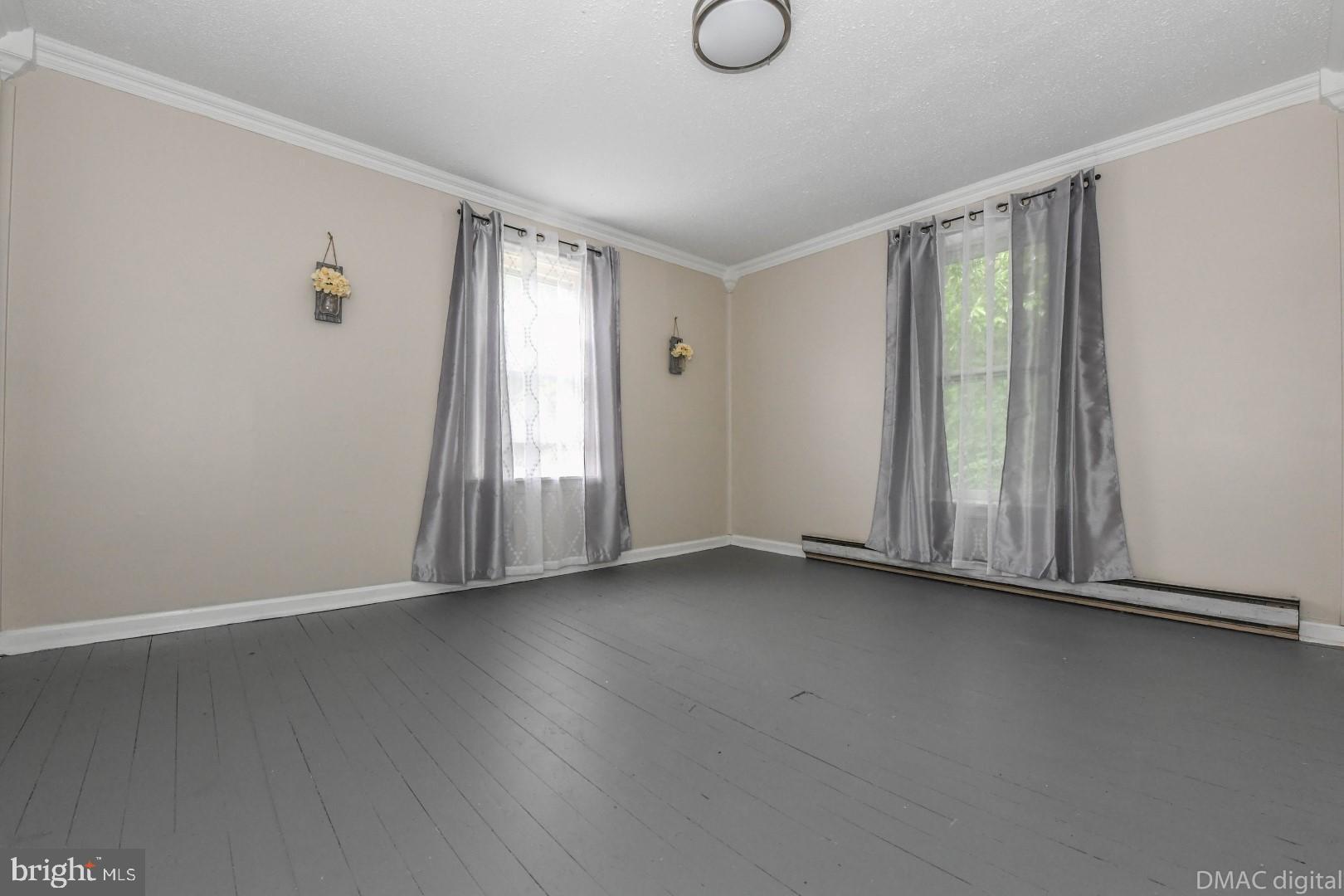 12512 Rockdale Road Clear Spring, MD 21722 - Photo 20 of 31 an empty room with wooden floor and windows