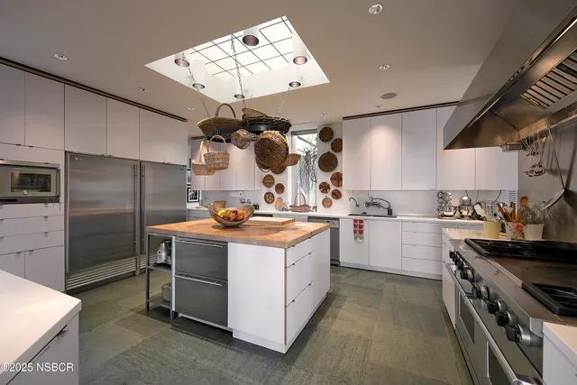 a kitchen with a stove oven and sink