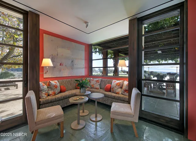 a living room with furniture and a window