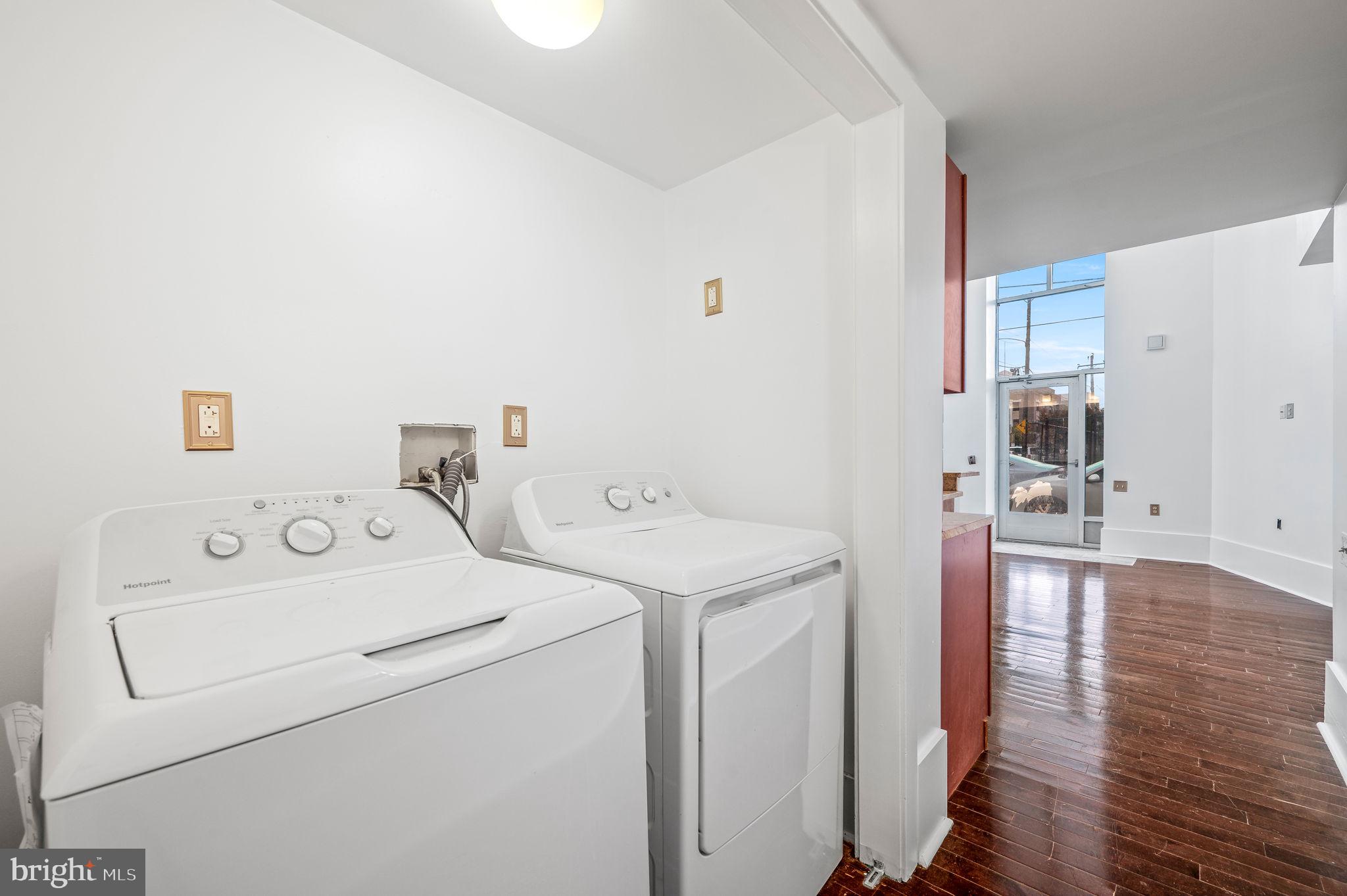 1201 South 5th Street Philadelphia, PA 19147 - Photo 18 of 57 a view of washer and dryer with bathroom in the background